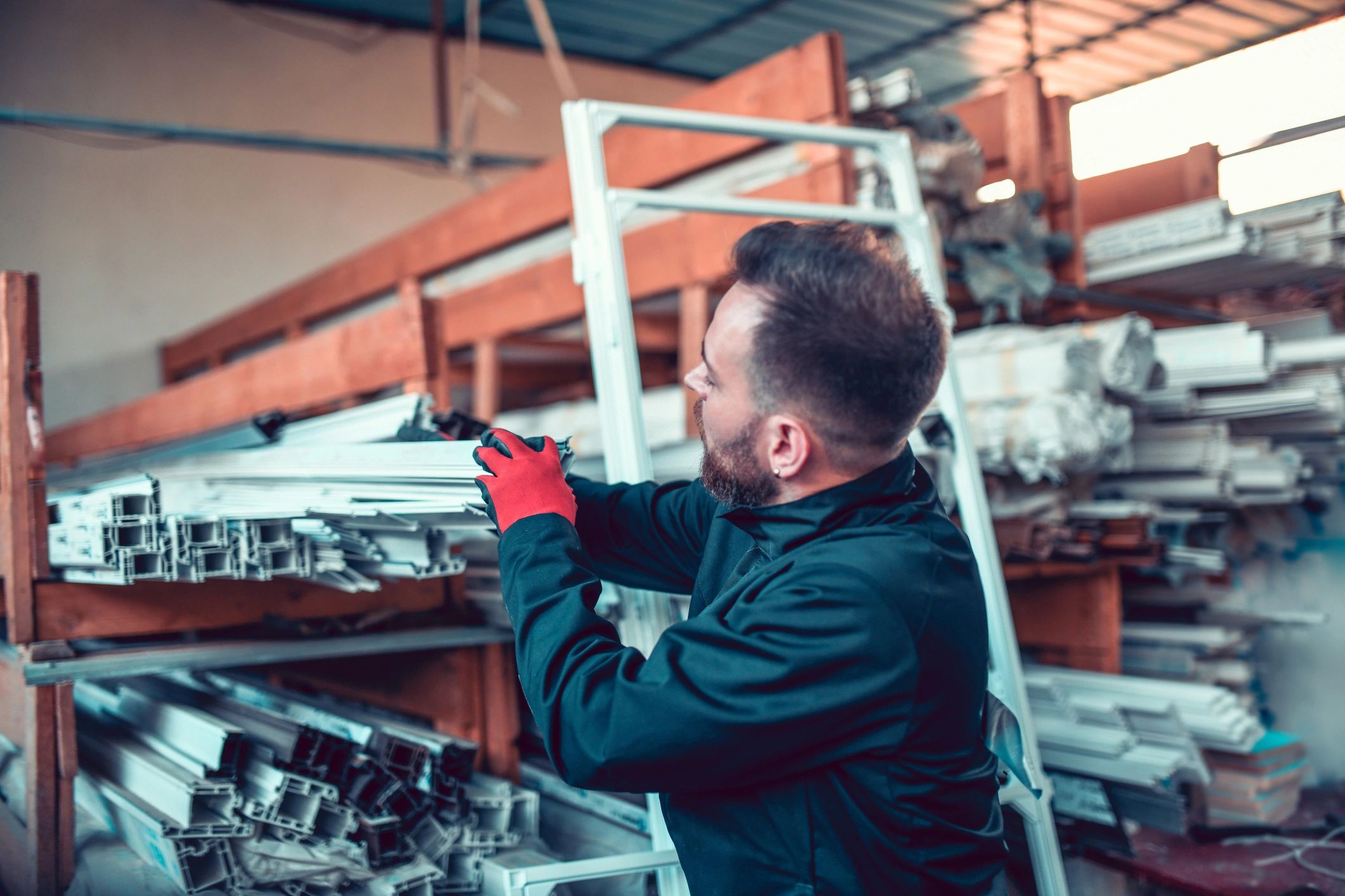 Worker handling products in a workshop, representing production operations