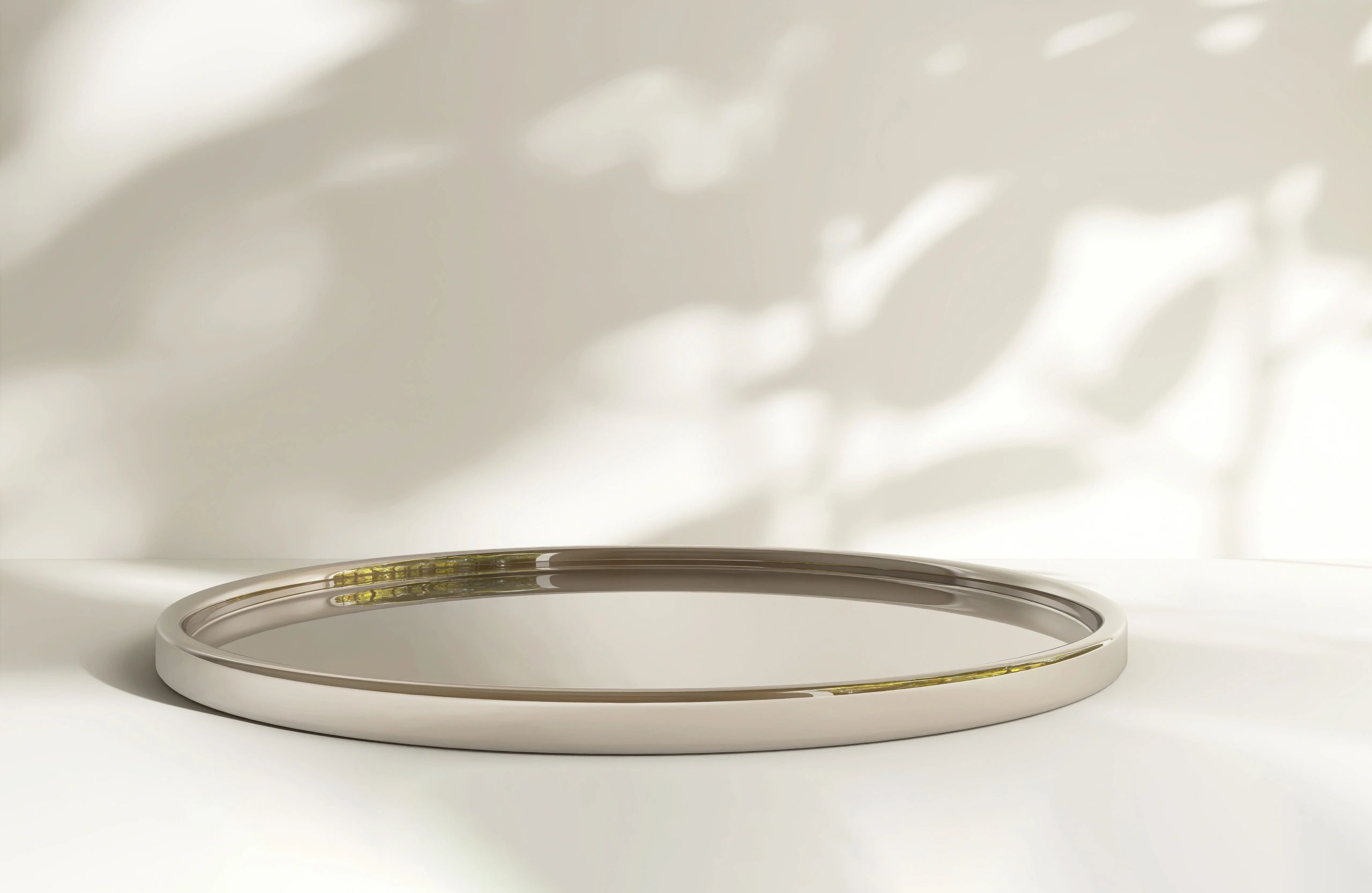Gold-toned polished metal plate used as a luxury product display surface