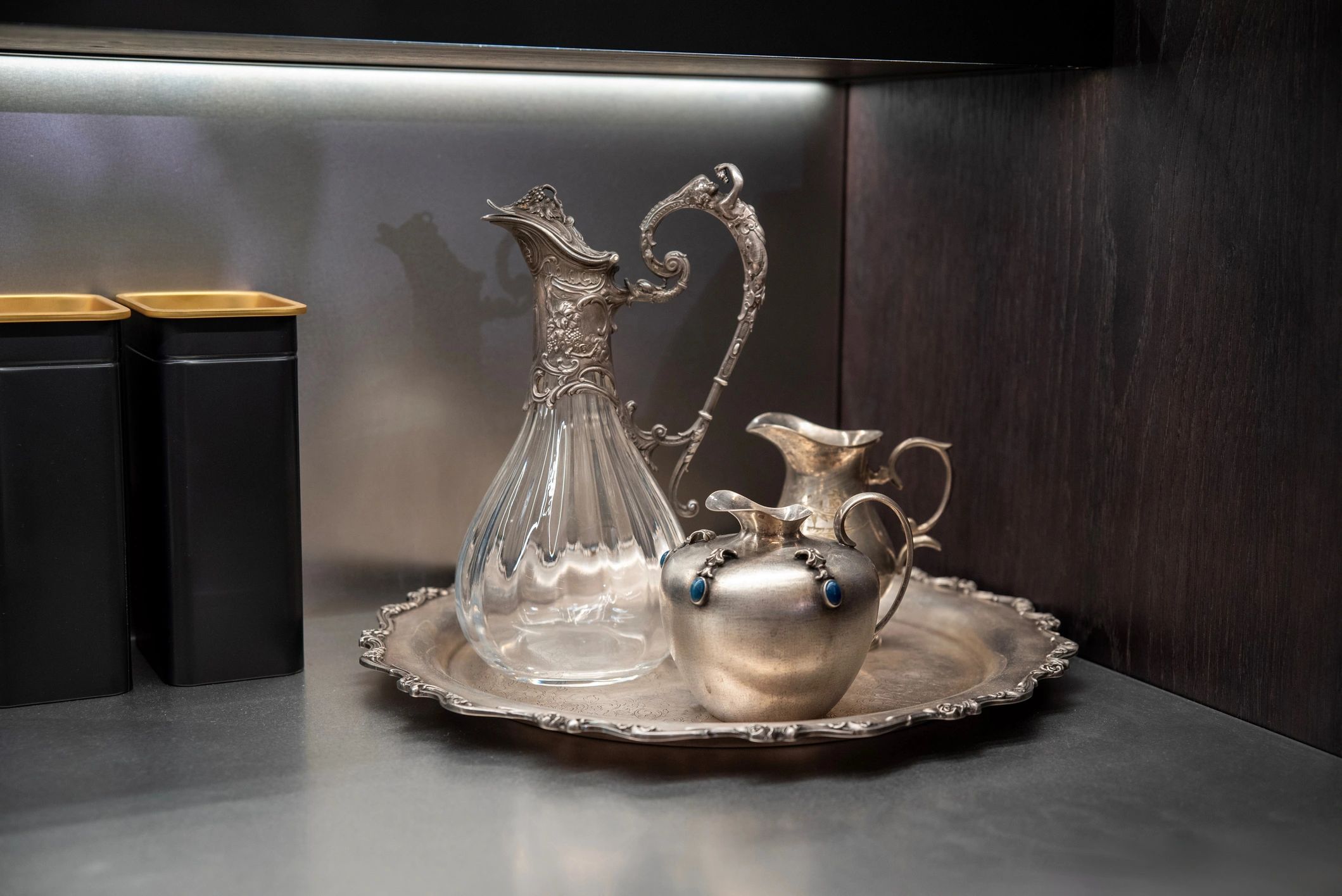 Polished metal tray with reflective surfaces and premium tableware